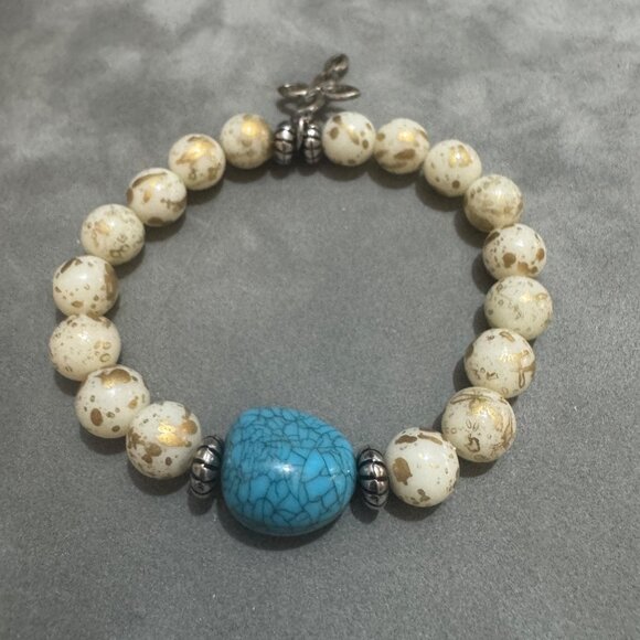Turquoise Stone Cream and Gold Beaded Stretch Bracelet With Cross Charm - Picture 3 of 4